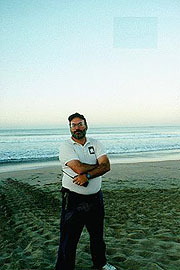 Dr. Frank Paladino standing by leatherback tracks